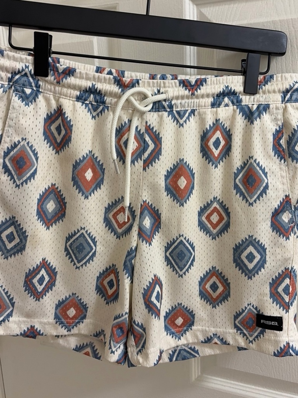 RSQ Cream Athletic Shorts with Blue and Rust Geo Print